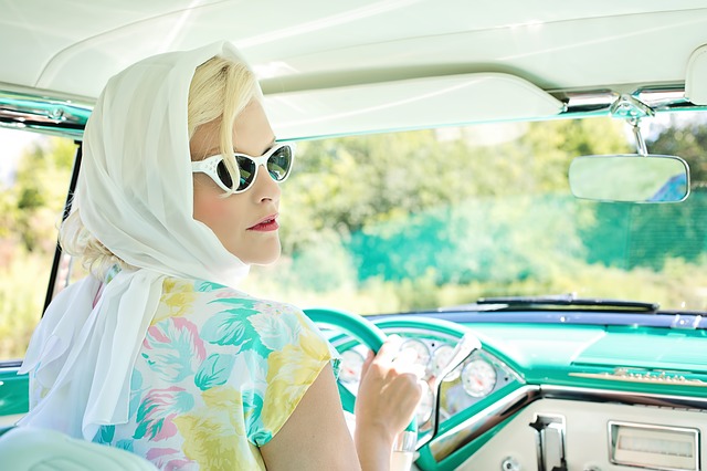 woman driving vintage car