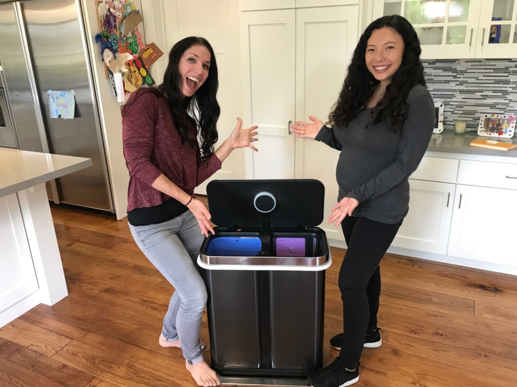 Kelly and Sara show off the Garbi trash can which makes grocery shopping fast and easy