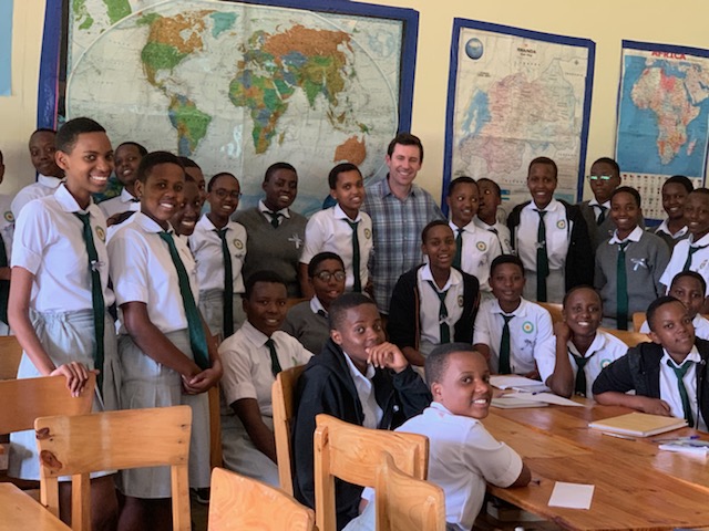 volunteer and students at the rwanda girls initiative